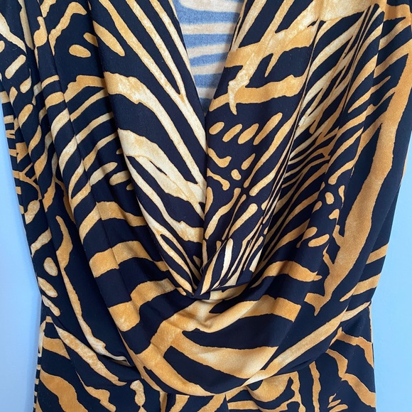 A tiger printed blouse and lower V neckline with a drape style at the front . - Picture 3 of 4